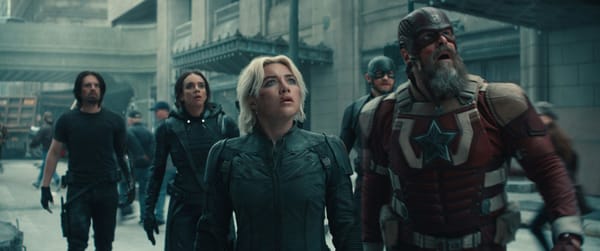 The full Thunderbolts team on the streets of New York City, looking up at something, horrified.